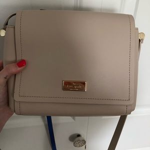Cream Kate Spade crossbody bag with blue interior